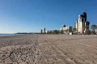 The broad sand and seafront of Alicante's San Juan beach
