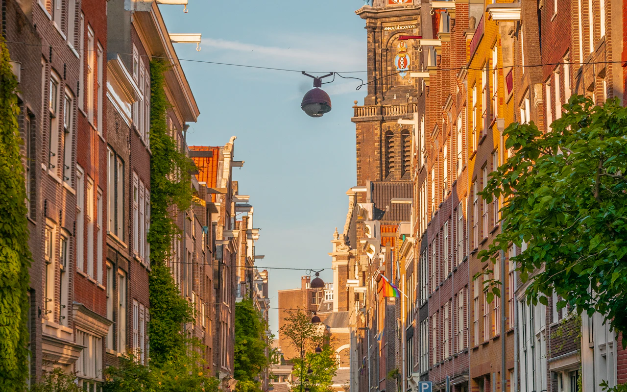 A residential street in the Jordaan with the Westerkerk tower in the distance