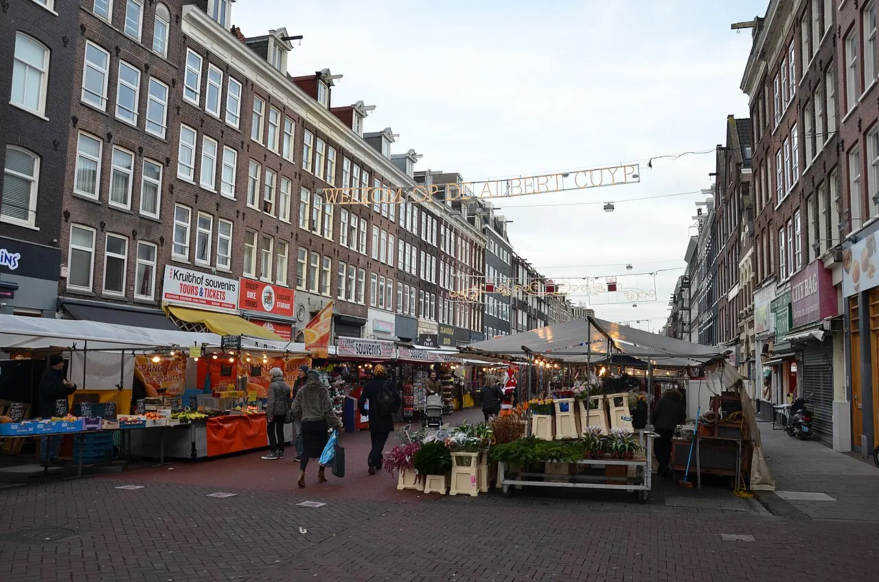 Shoppers and stalls along Albert Cuyp Market in De Pijp