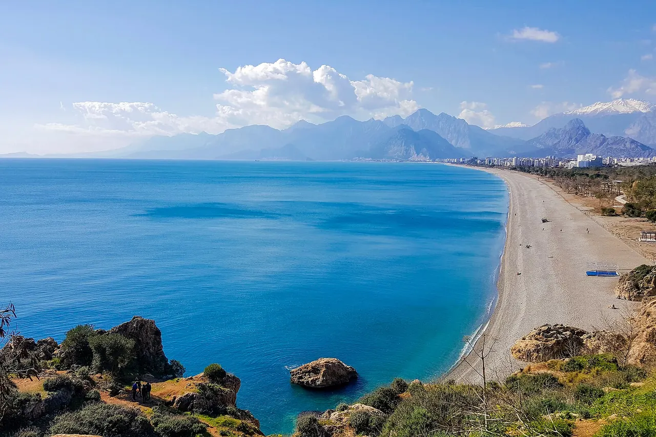 Konyaalti Beach curving along the sea below Antalya's cliffs