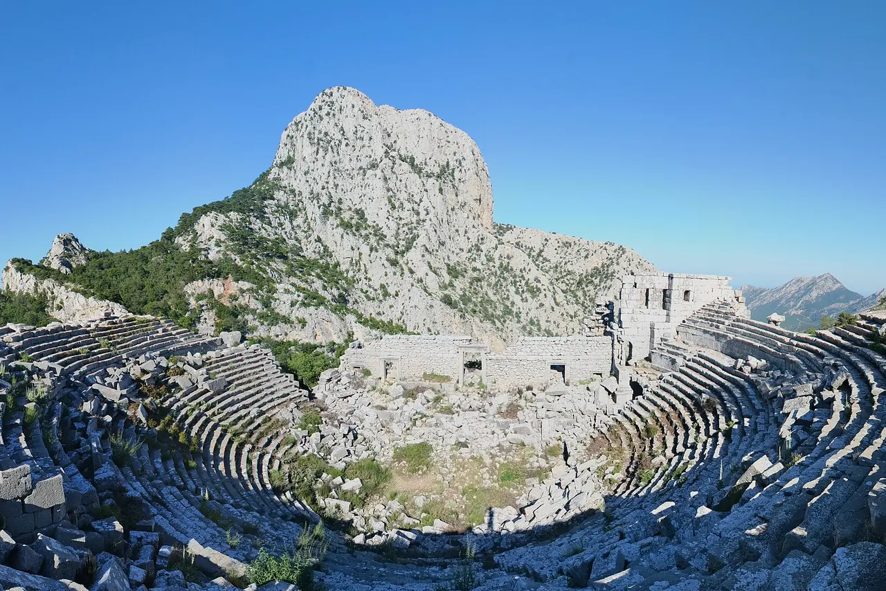 The stone theatre at Termessos with mountain ridges beyond