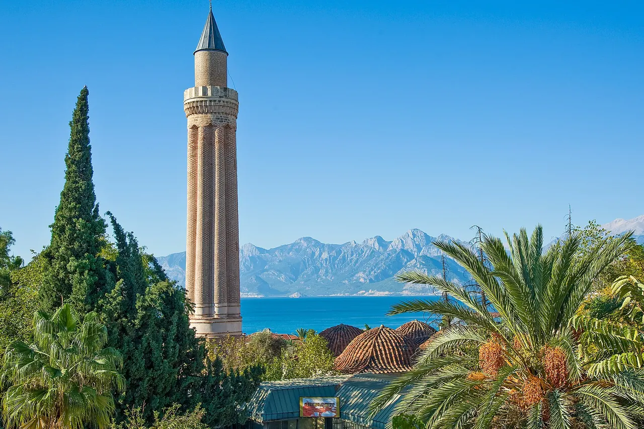 The brick fluted minaret above the domes of Yivli Minare Mosque