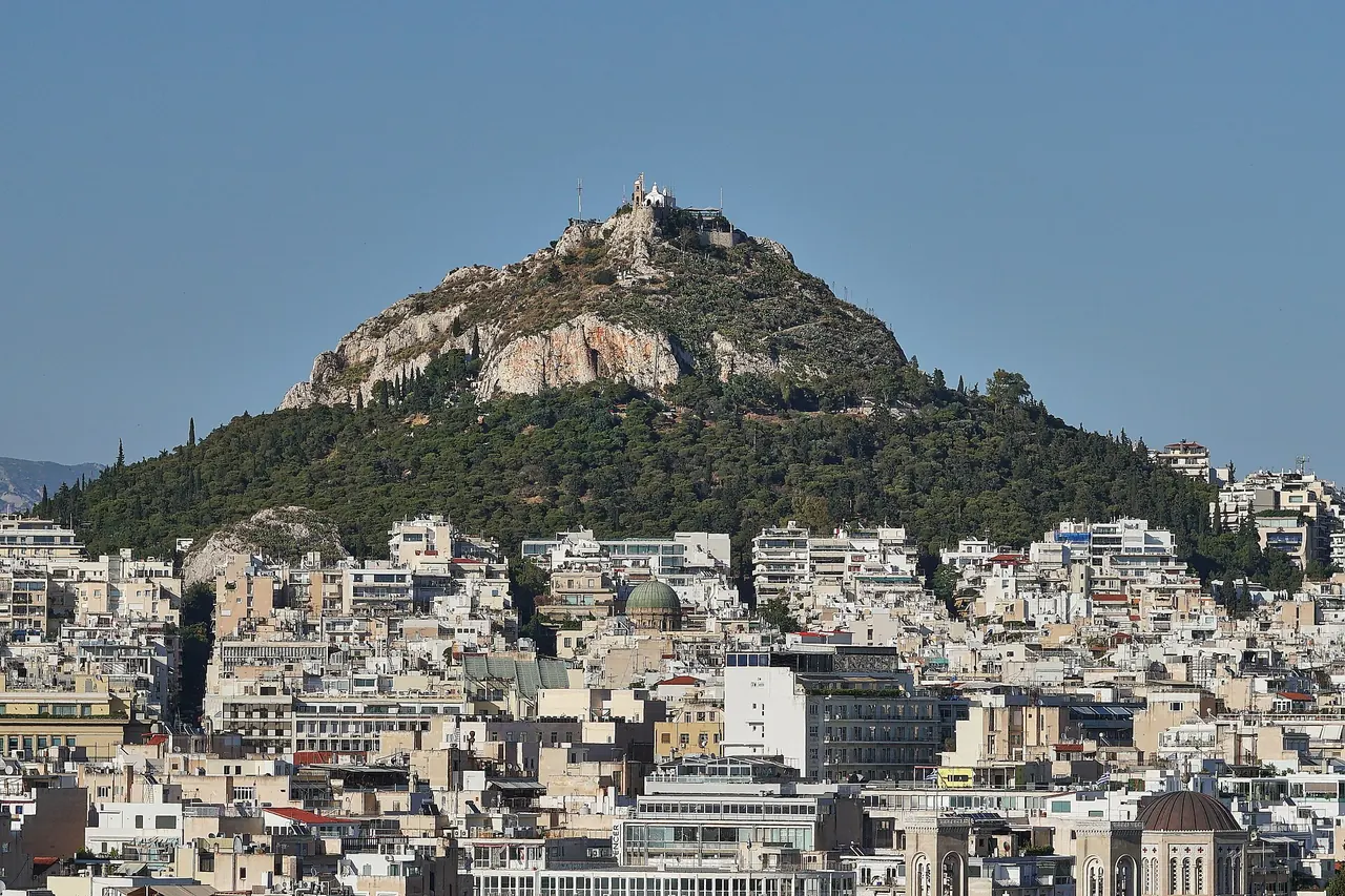 Lycabettus Hill rising above the dense streets of Athens