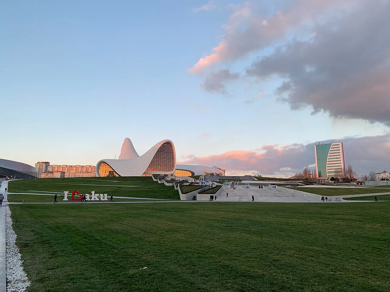 Sweeping white curves of the Heydar Aliyev Center above lawns in Baku