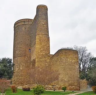 The cylindrical stone Maiden Tower and its projecting buttress in Baku