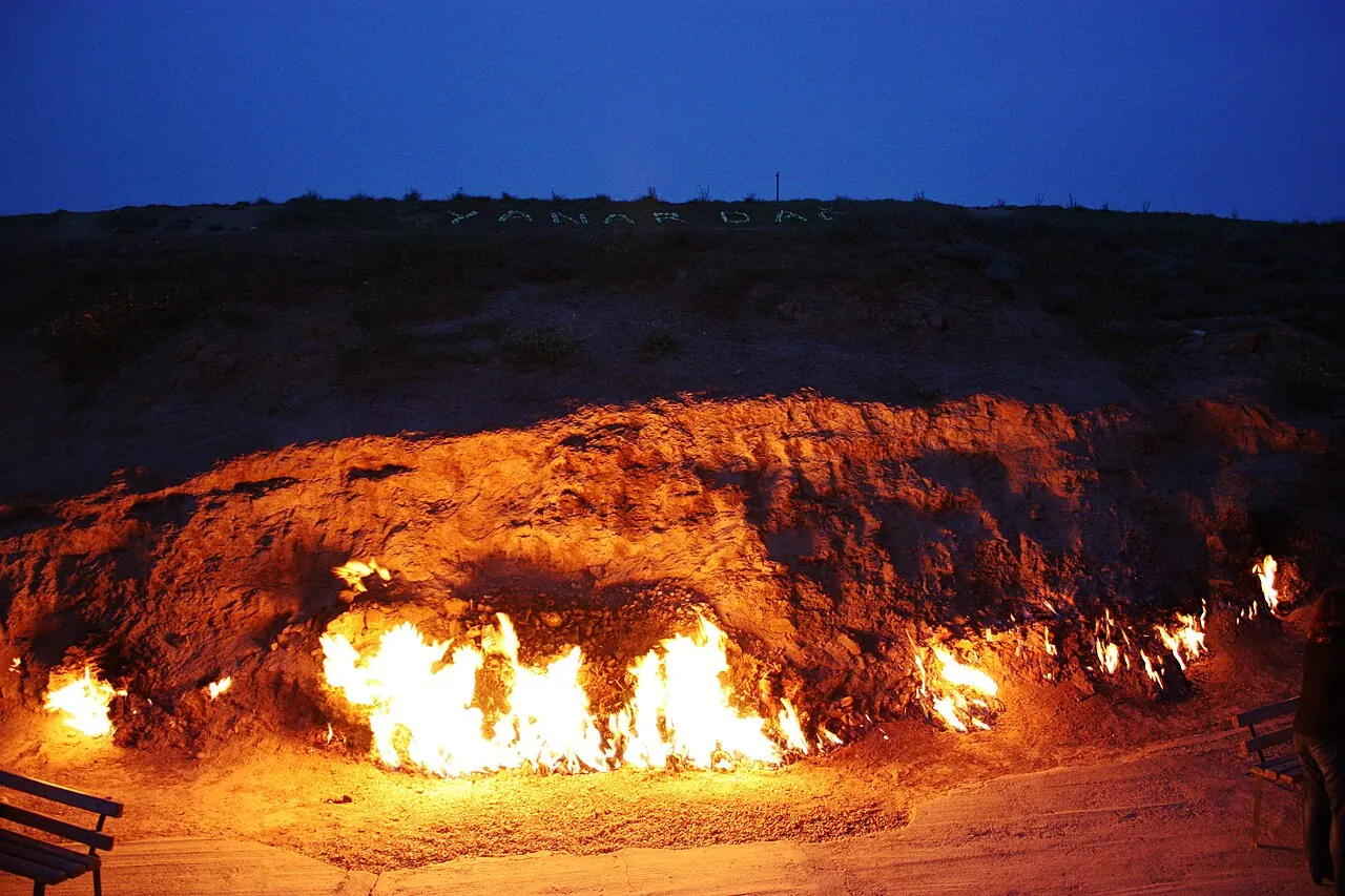 Flames burning along the rocky slope at Yanar Dag