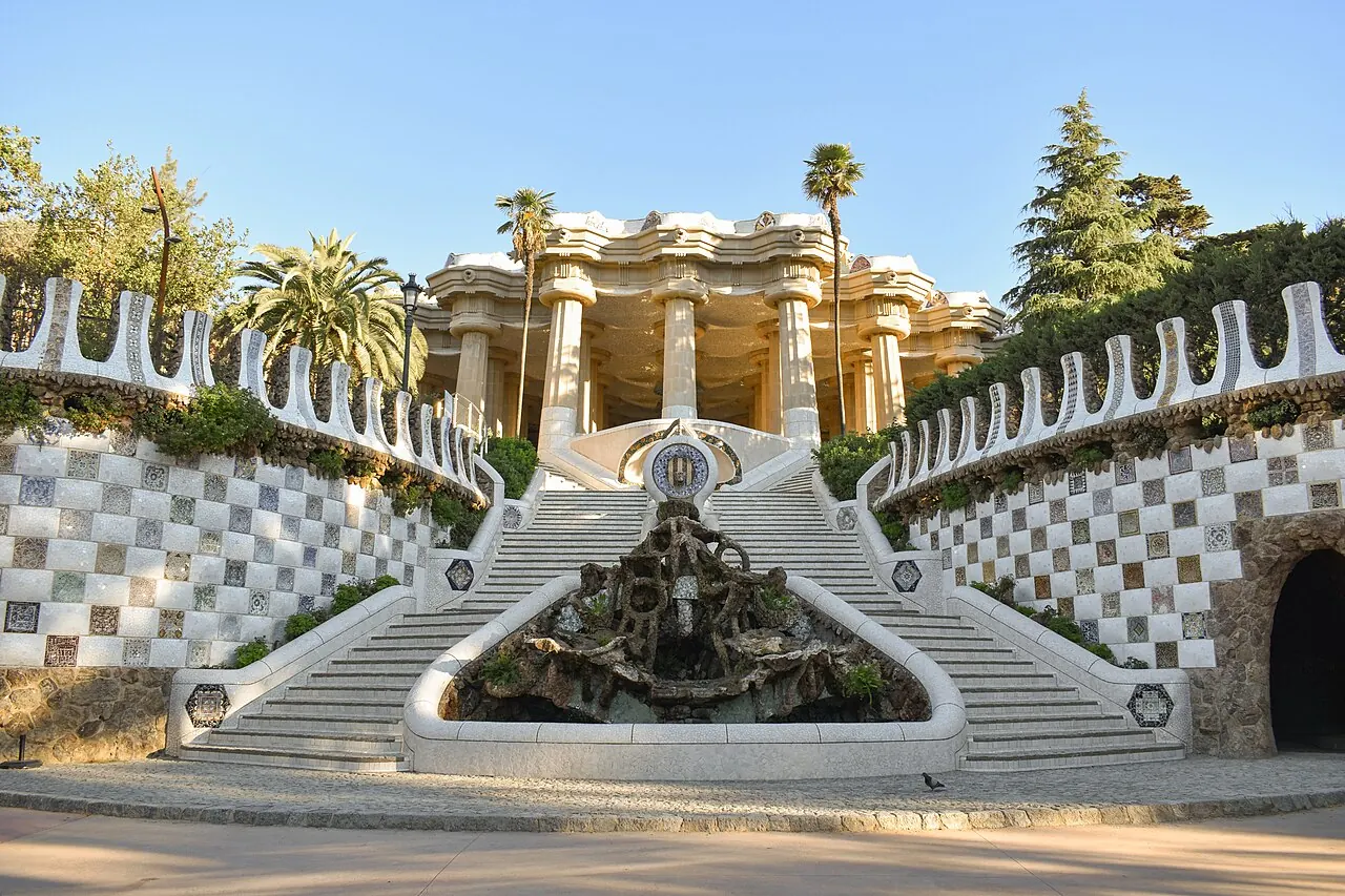 Park Guell's mosaic terrace and entrance buildings overlooking Barcelona
