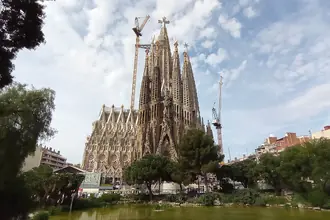 The towers and richly detailed facade of Sagrada Familia in Barcelona