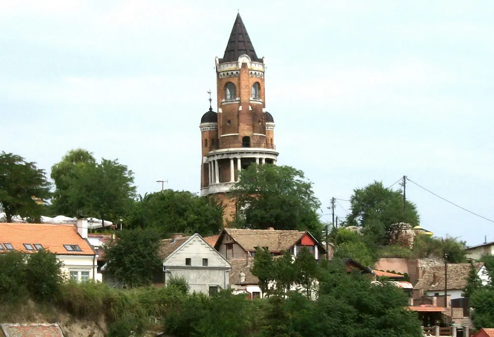 Gardos Tower rising above stone walls and red roofs in Zemun