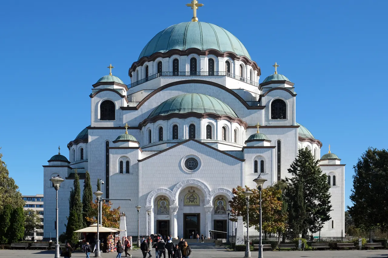 White facade and domes of the Church of Saint Sava in Belgrade