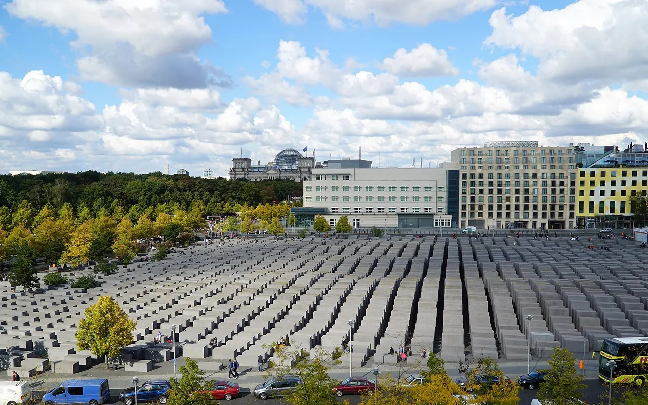 An elevated view across the concrete stelae of the Memorial to the Murdered Jews of Europe