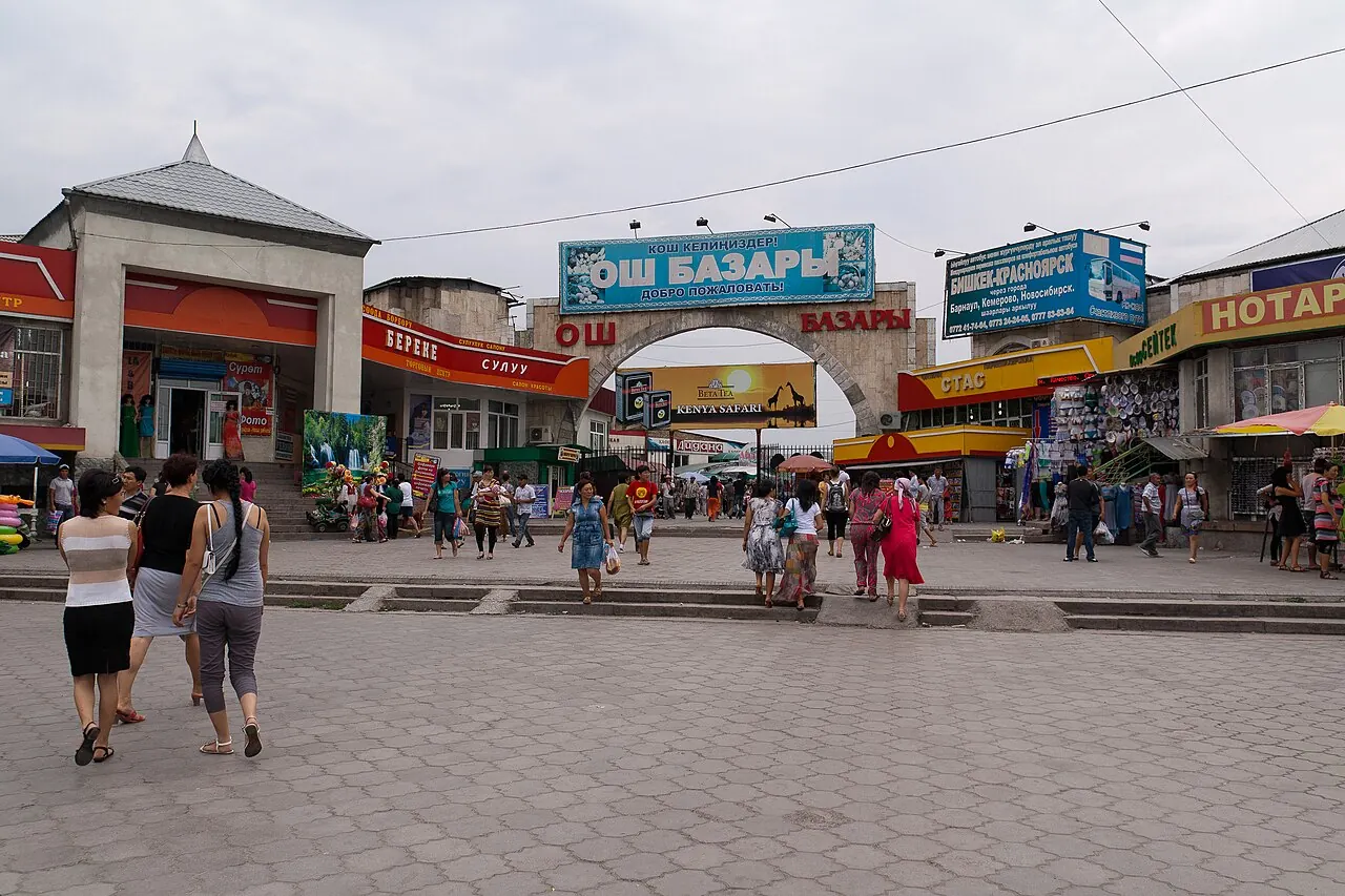 Shoppers outside the main entrance of Osh Bazaar in Bishkek