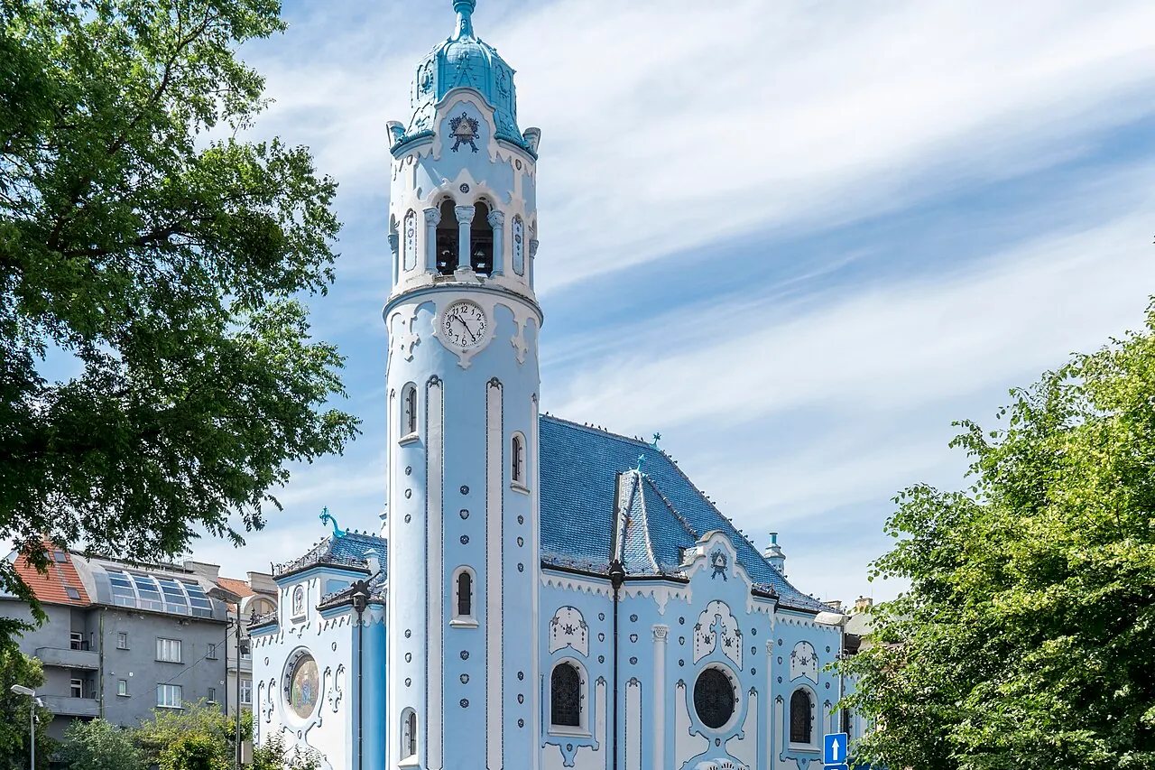 The pale-blue Church of Saint Elizabeth with its round tower and glazed decoration