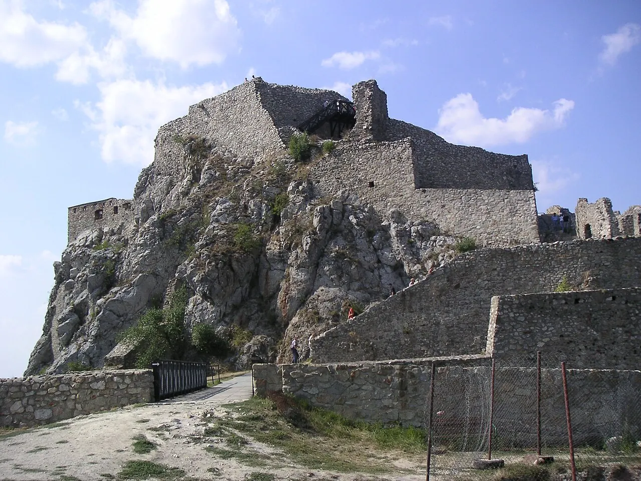 The ruined walls of Devin Castle on a high rock above the river landscape