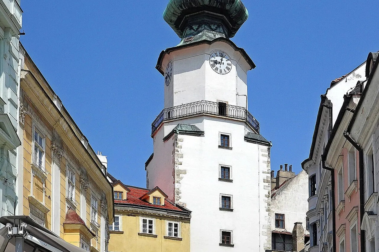 Michael's Gate and its copper-roofed tower above the old-town street