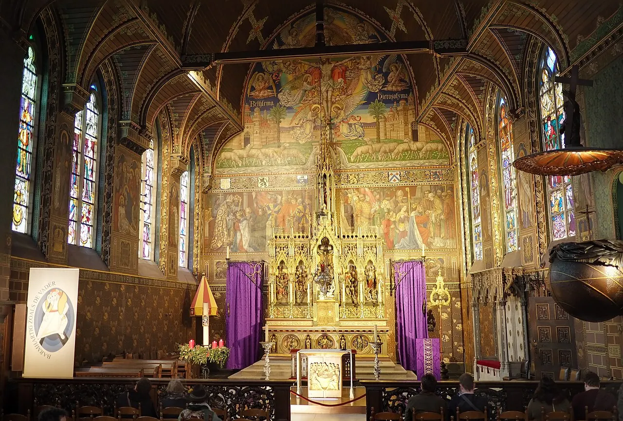 The richly decorated altar and interior of the Basilica of the Holy Blood in Bruges