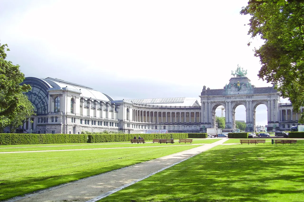 The monumental arcade and open lawns of Cinquantenaire Park in Brussels