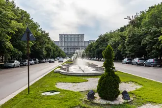 Palace of Parliament seen along Unirii Boulevard in Bucharest