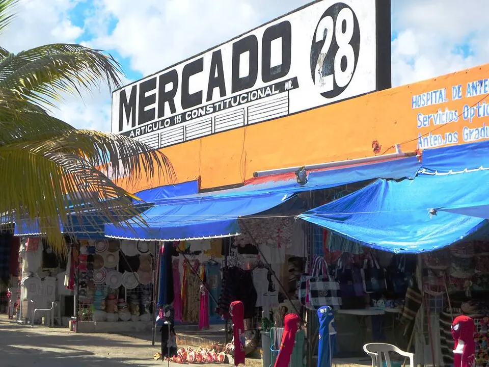Colourful shopfronts and the Mercado 28 entrance sign in downtown Cancun