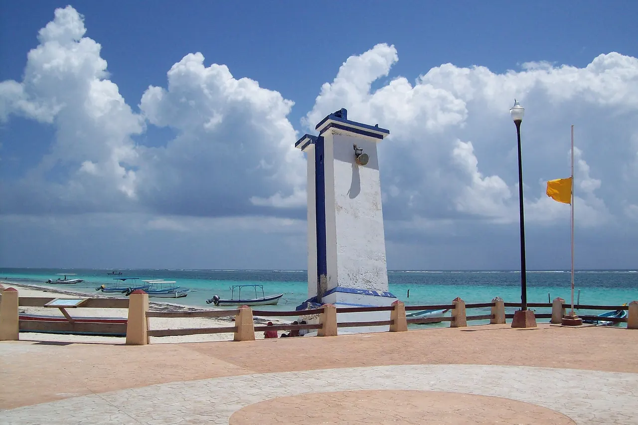 Puerto Morelos lighthouse with the sea and offshore reef beyond