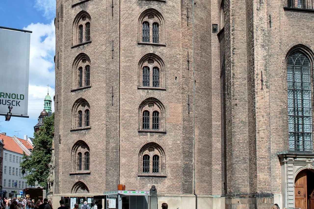 The brick Round Tower rising above a Copenhagen street