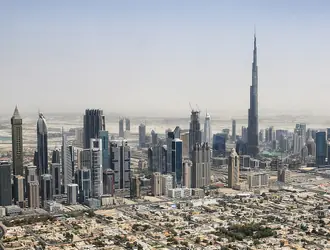 Burj Khalifa rising above Downtown Dubai and the surrounding skyline