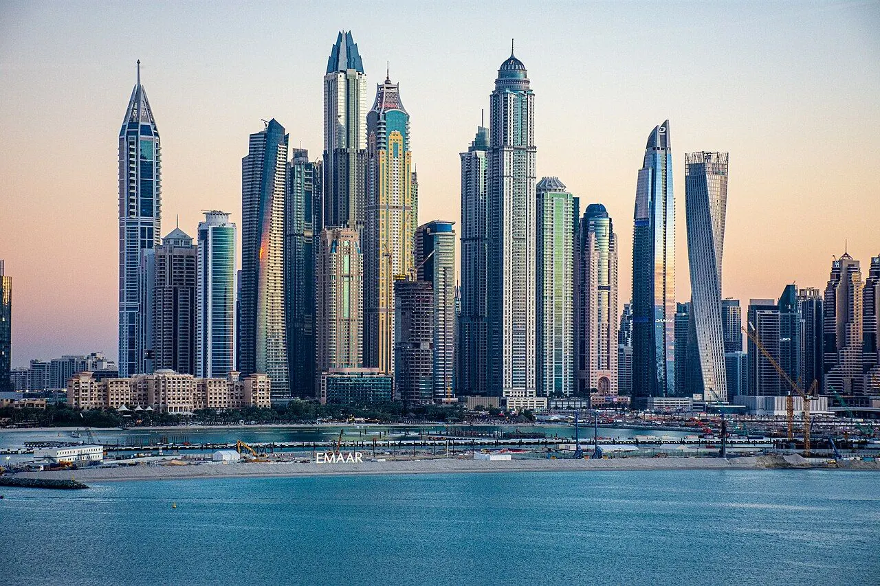 Dubai Marina's high-rise buildings reflected in the water