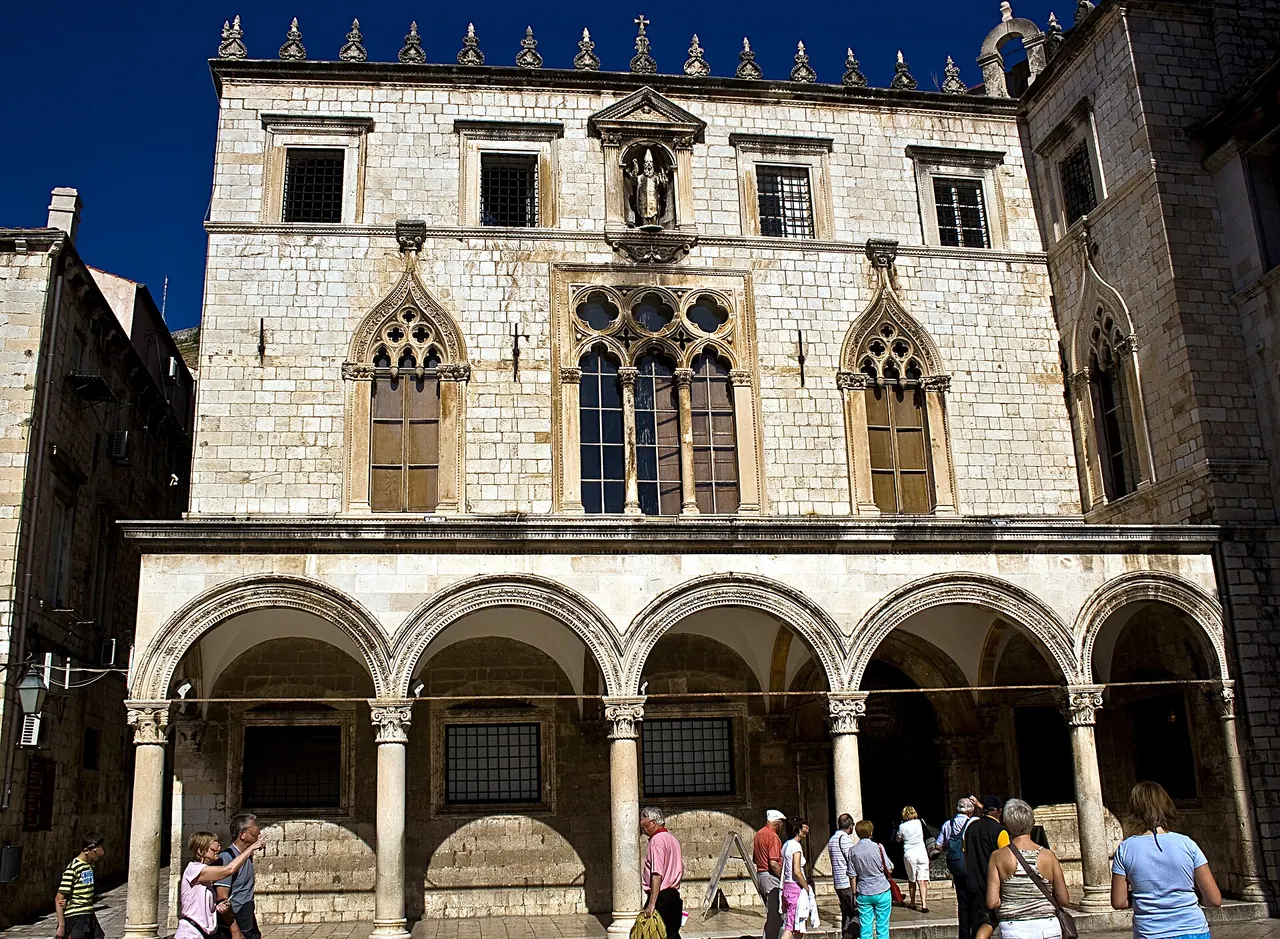 The Gothic windows and Renaissance arcade of Sponza Palace in Dubrovnik