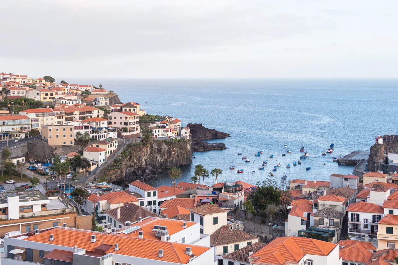 Fishing boats and waterfront houses in Camara de Lobos