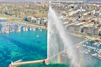 Aerial view of Geneva’s Jet d’Eau spraying above the harbour and jetty