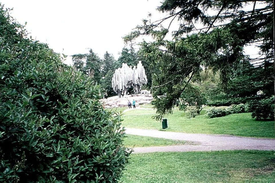 The Sibelius Monument's steel pipe sculpture among trees in its Helsinki park setting