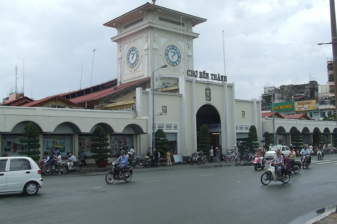 Ben Thanh Market's clock tower and entrance facing a busy street
