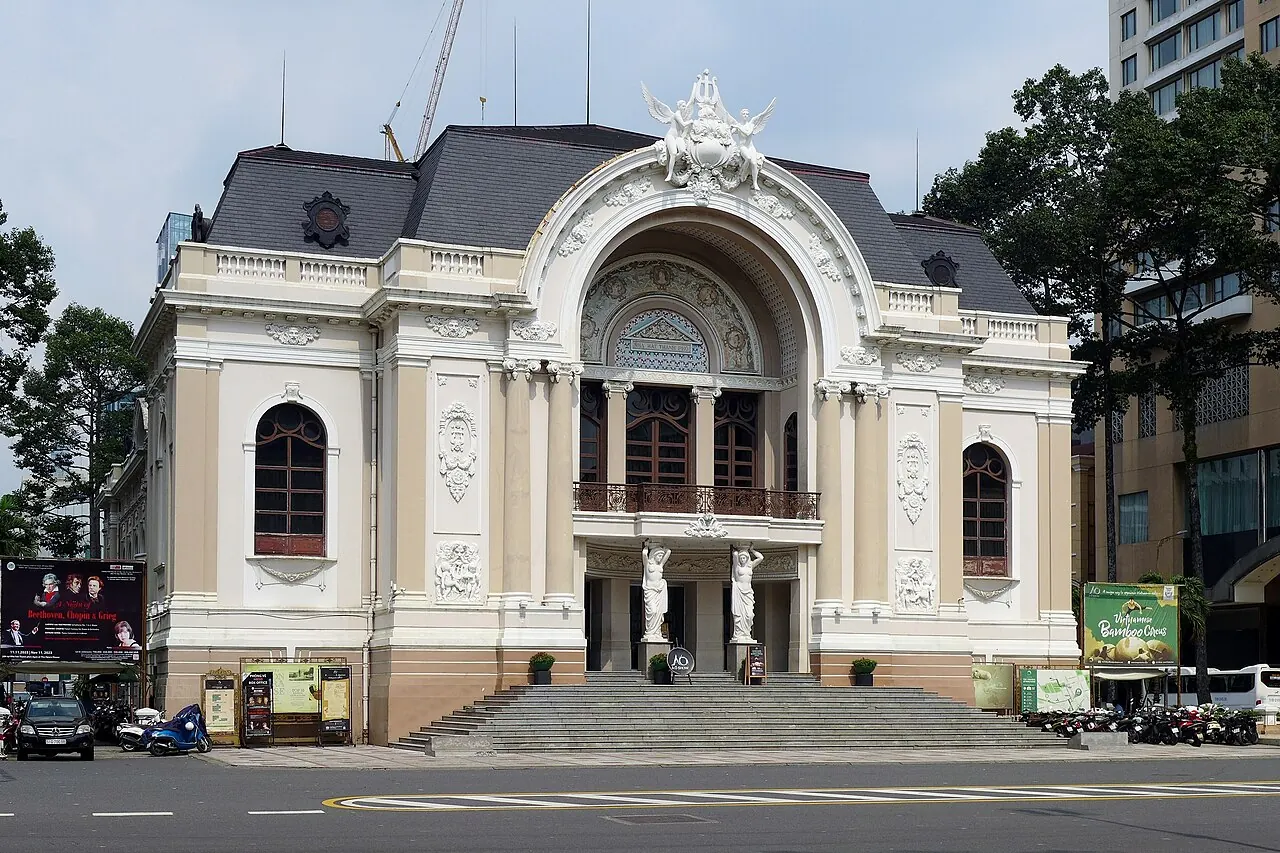 The white facade and arched entrance of Saigon Opera House