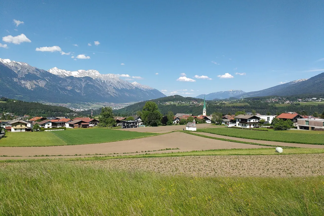 The village of Mutters with mountains beyond