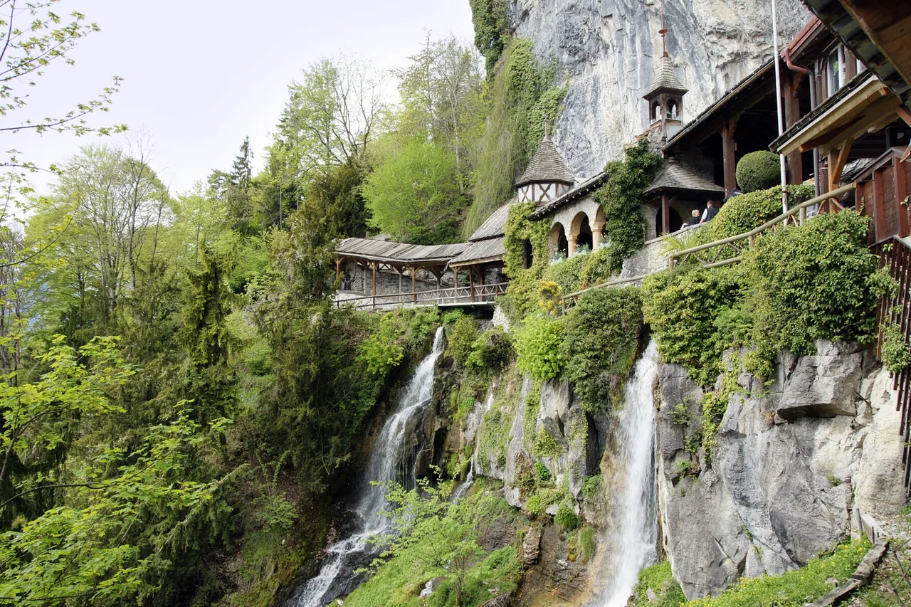 The entrance buildings and falls at St Beatus Caves