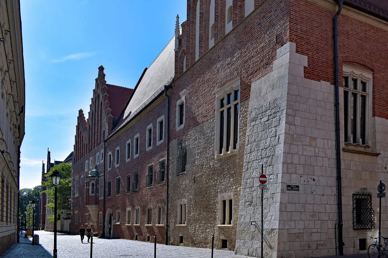 The historic brick facade and doorway of Collegium Maius in Krakow