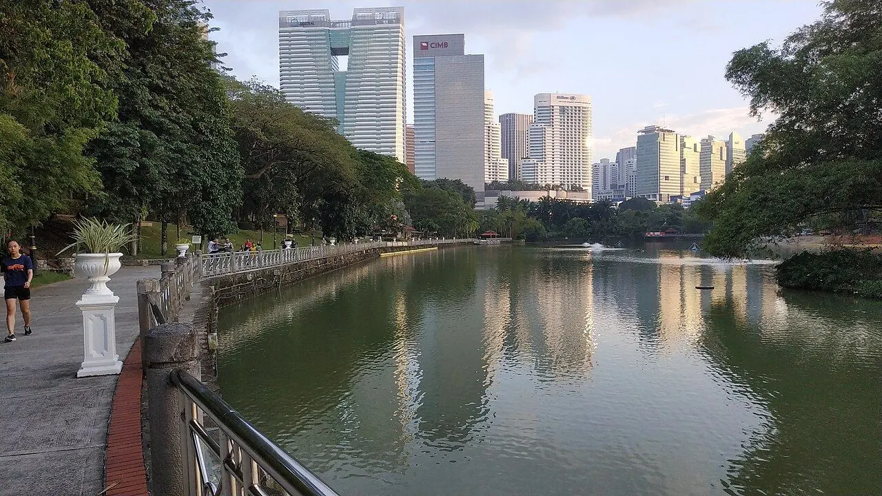 Lakeside paths and tropical trees in Perdana Botanical Gardens