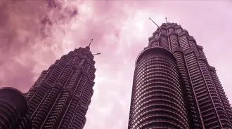 Petronas Twin Towers rising above KLCC in Kuala Lumpur