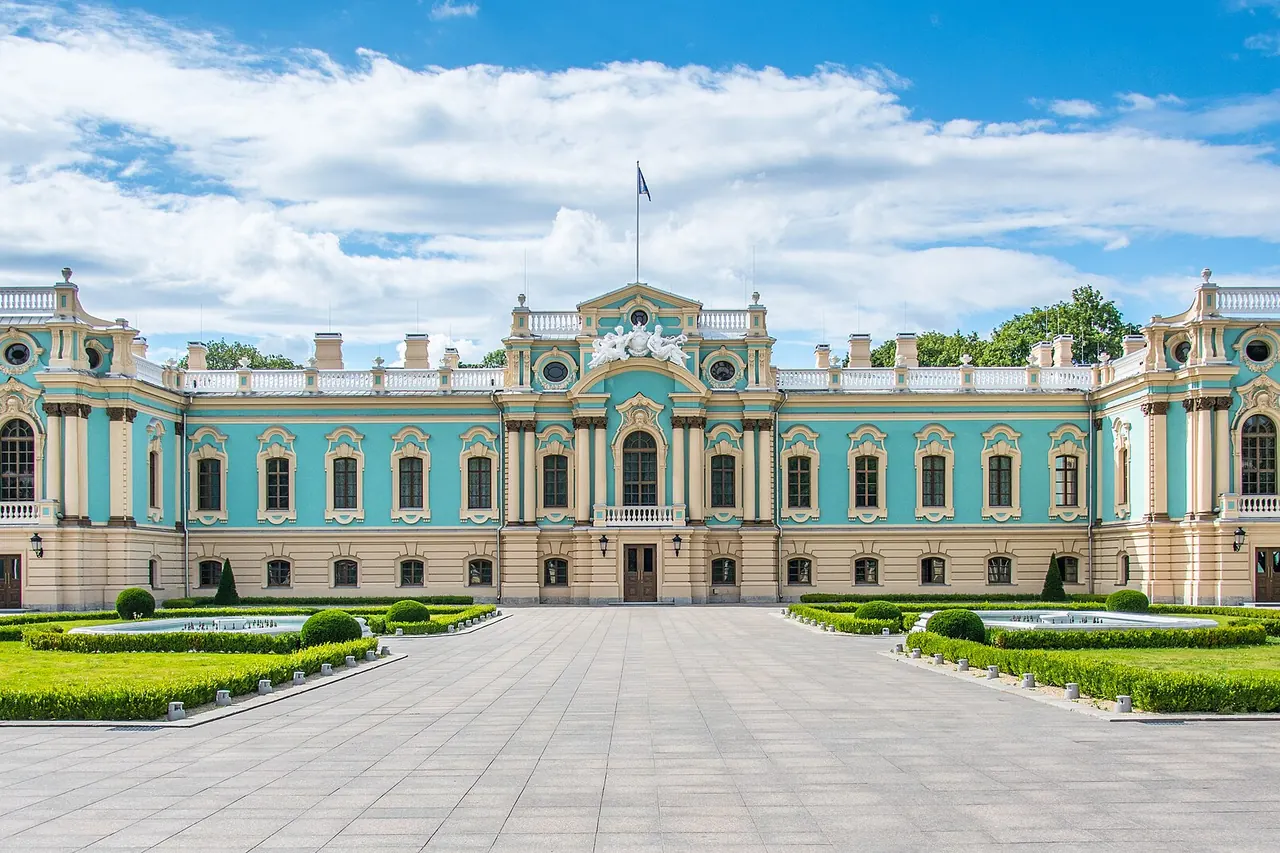 The blue-and-cream facade of Mariyinsky Palace overlooking its formal grounds