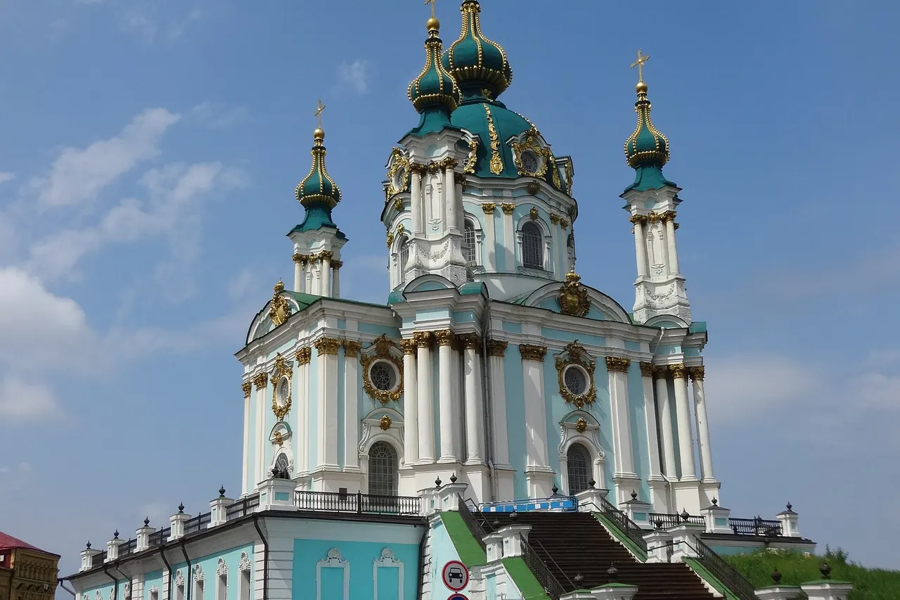 Saint Andrew's Church with its green dome and ornate facade above Andriivskyi Descent