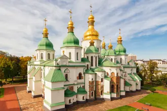 Saint Sophia Cathedral's white walls, green roofs and gilded domes in Kyiv