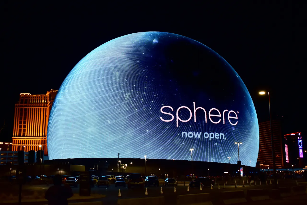 Sphere's illuminated exterior beside the Las Vegas skyline