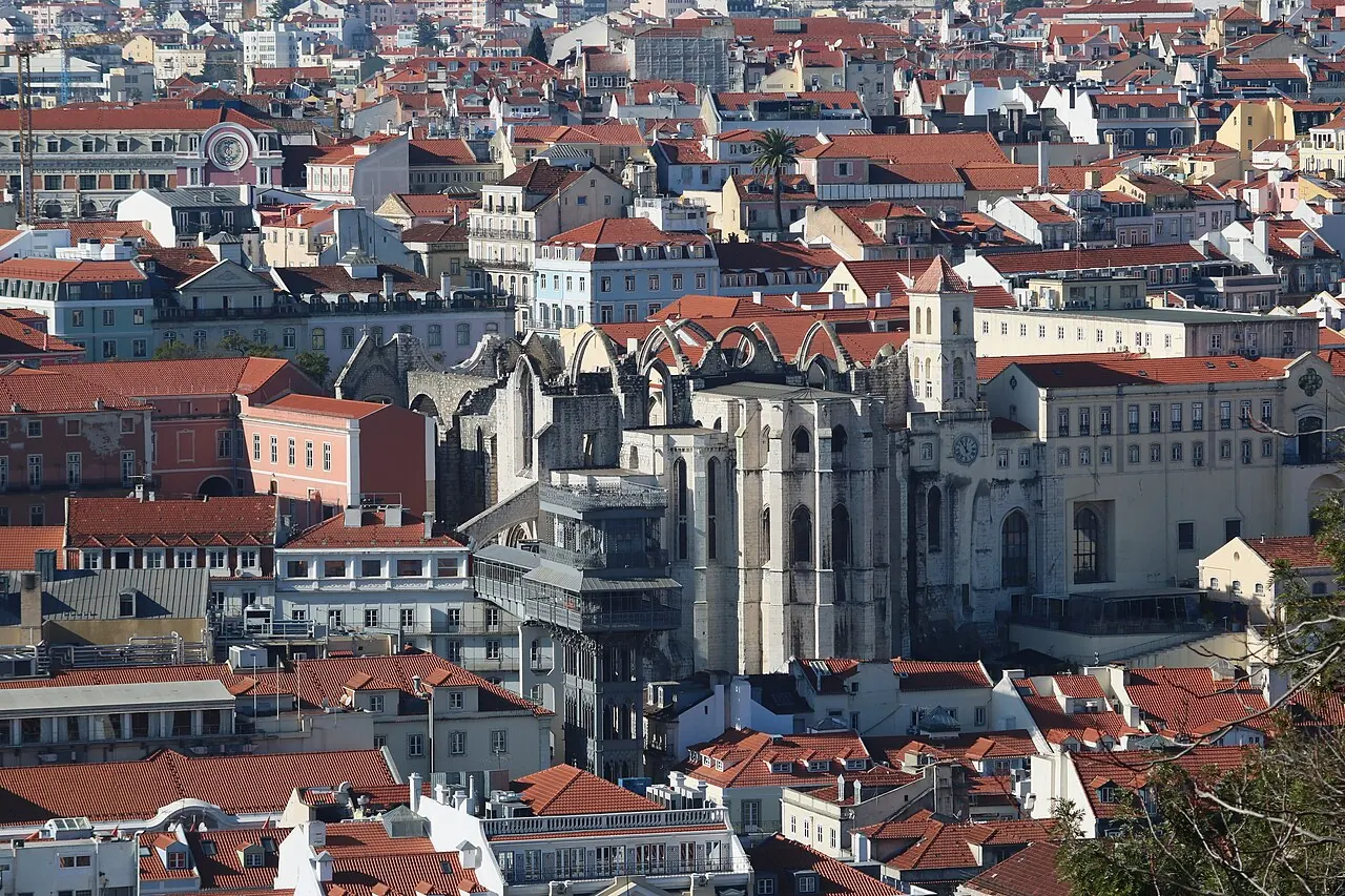 The surviving walls of Carmo Convent rising above Lisbon's central rooftops