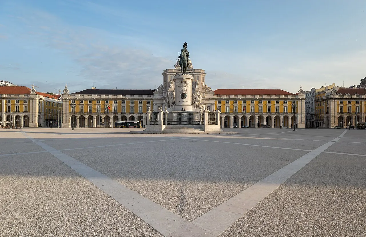 Praca do Comercio's yellow arcades and central statue facing Lisbon's riverfront