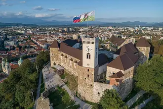 Ljubljana Castle and its hill above the rooftops of the city
