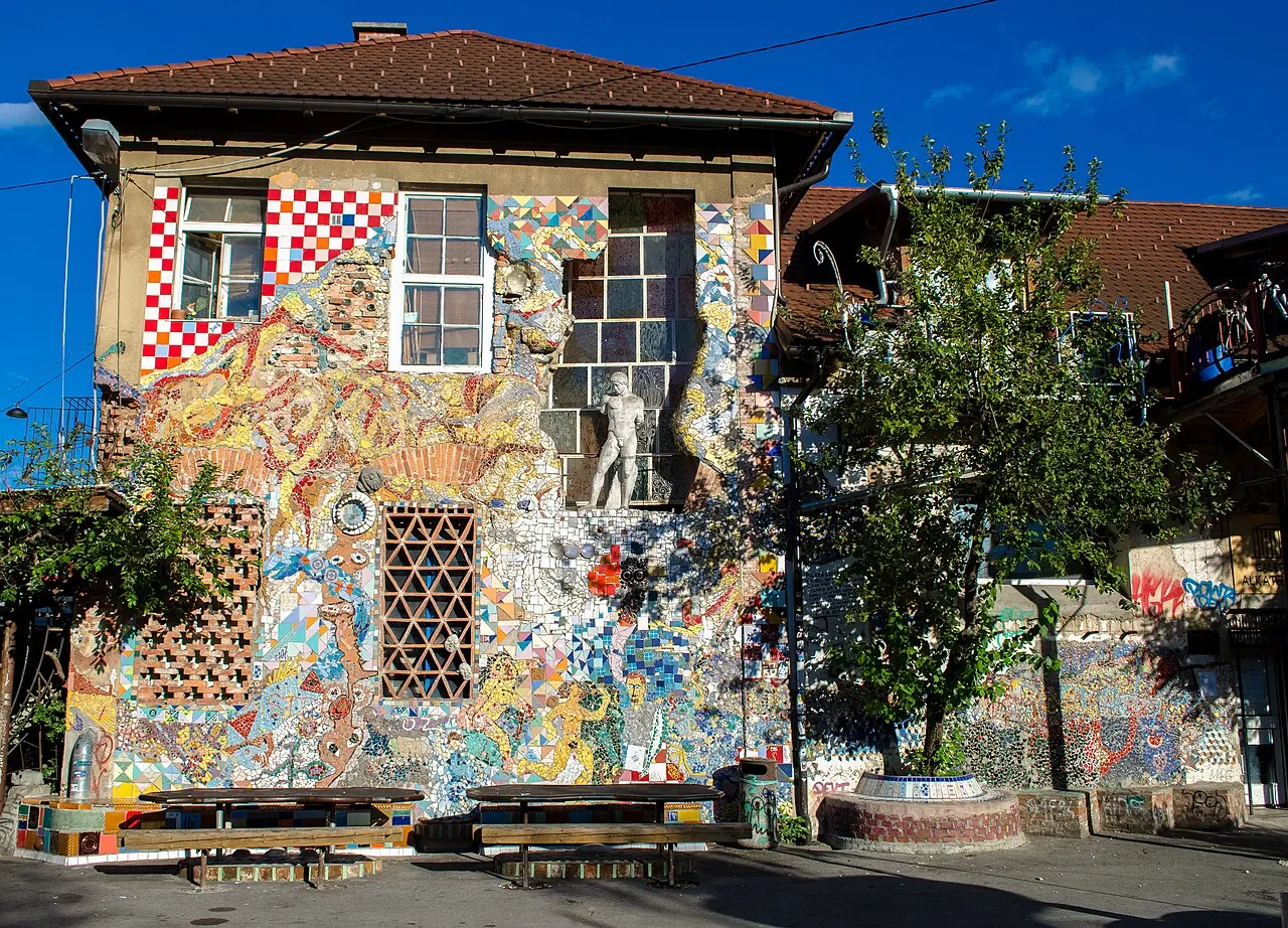 Colourful artworks and decorated buildings in the Metelkova cultural quarter