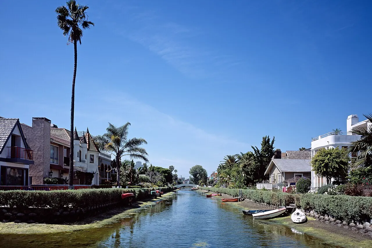 Houses, footpaths and a pedestrian bridge beside the Venice canals