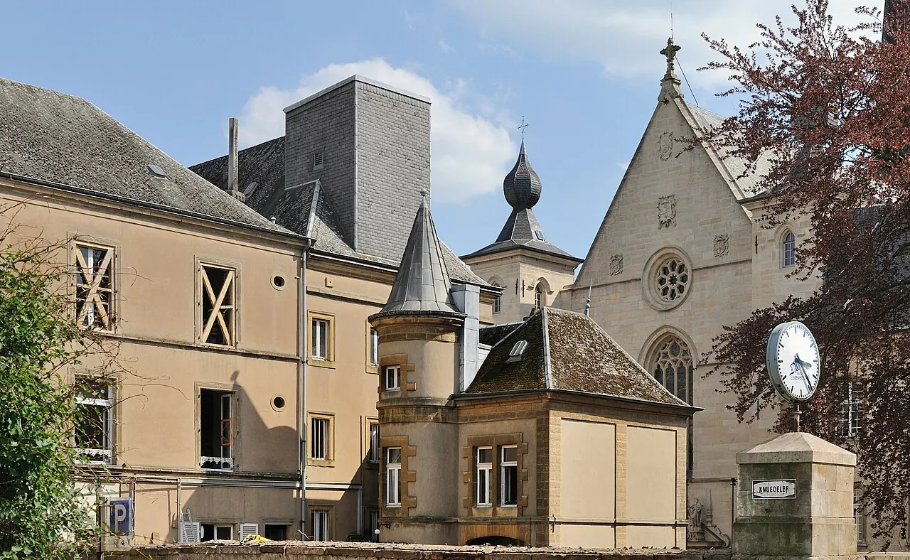 Notre-Dame Cathedral seen between buildings from Place Guillaume II in Luxembourg City