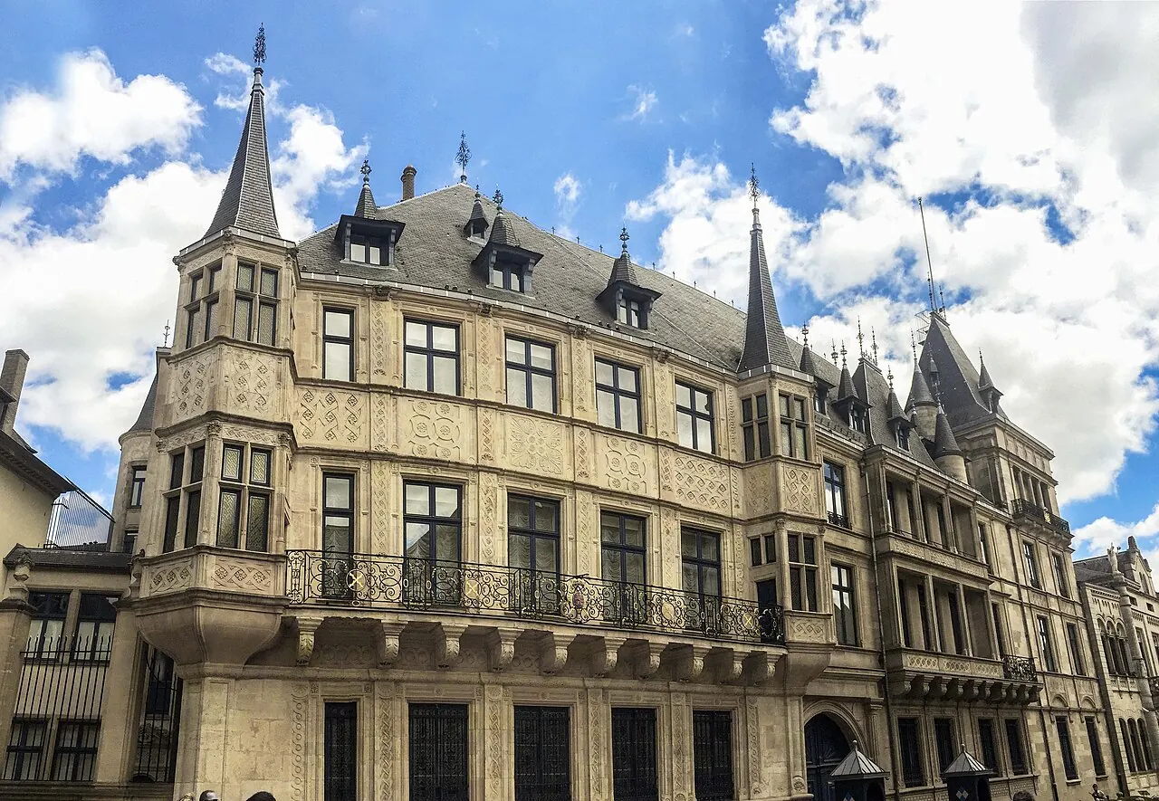 Decorated Grand Ducal Palace facade along a Luxembourg City street