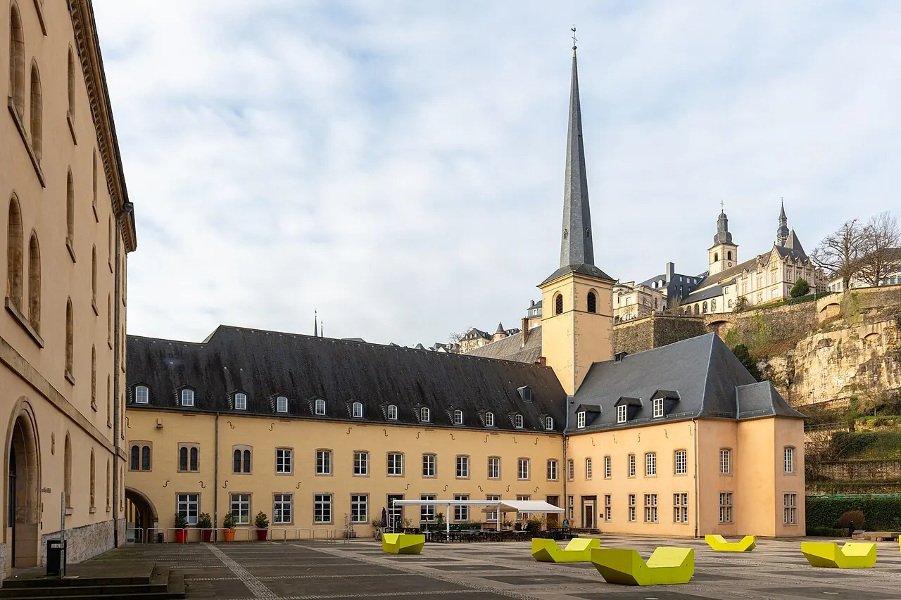 Neumunster Abbey courtyard and church tower in Luxembourg City’s Grund